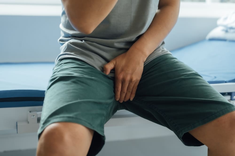 Close up man suffering from testicular pain